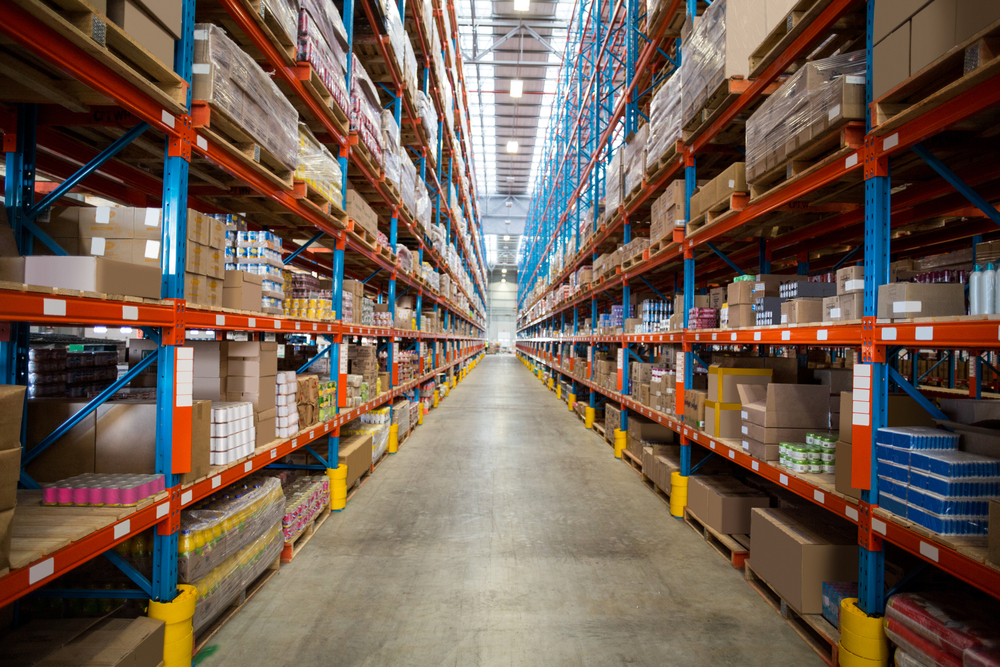 Boxes kept on row of shelves in the warehouse